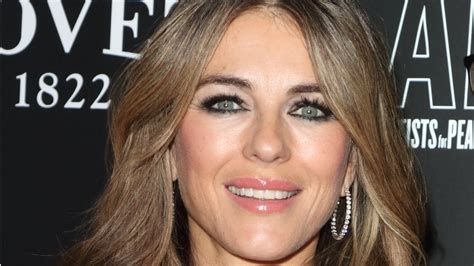 Elizabeth Hurley Reveals Her Curves In A Pink Gown With An Essential