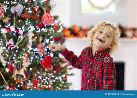 Child Decorating Christmas Tree Kid On Xmas Eve Stock Image Image Of
