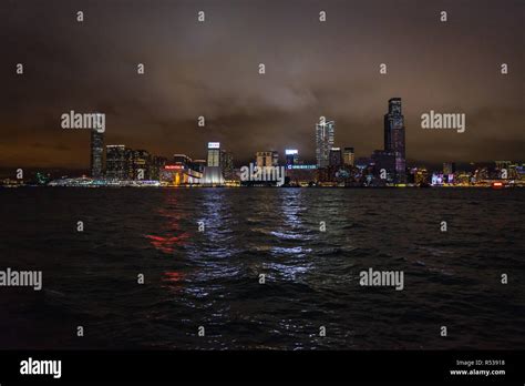 Kowloon Skyline At Night Viewed From Wan Chai Waterfront Hong Kong