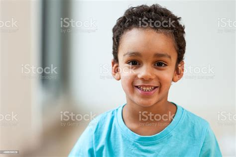 Portrait Of A Cute Little African American Boy Smiling Stock Photo