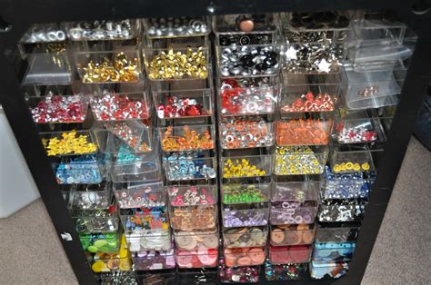 A Large Display Case Filled With Lots Of Different Colored Beads