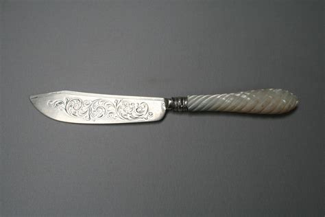 An Antique Silver Bladed Butter Knife With Mother Of Pearl Handle