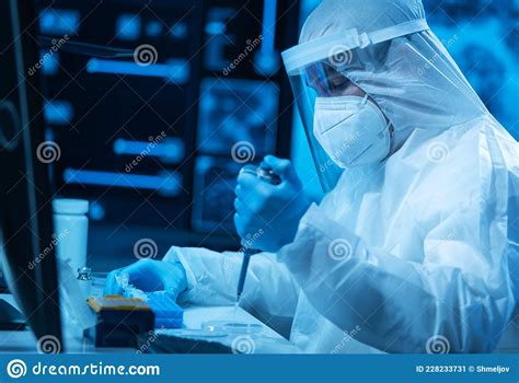 Scientist Works In A Modern Scientific Lab Using Laboratory Equipment