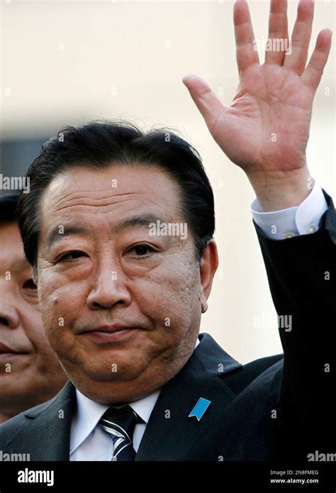 Japan S Prime Minister Yoshihiko Noda Of The Ruling Democratic Party Of Japan Waves During His