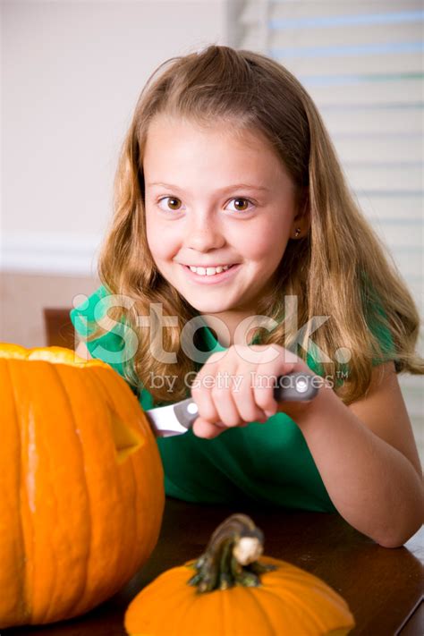 Little Girl Carving A Pumpkin Stock Photo Royalty Free Freeimages