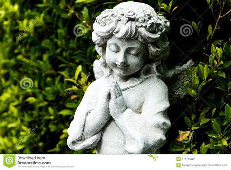 Statues Of Guardian Angels In Green Garden Stock Photo Image Of