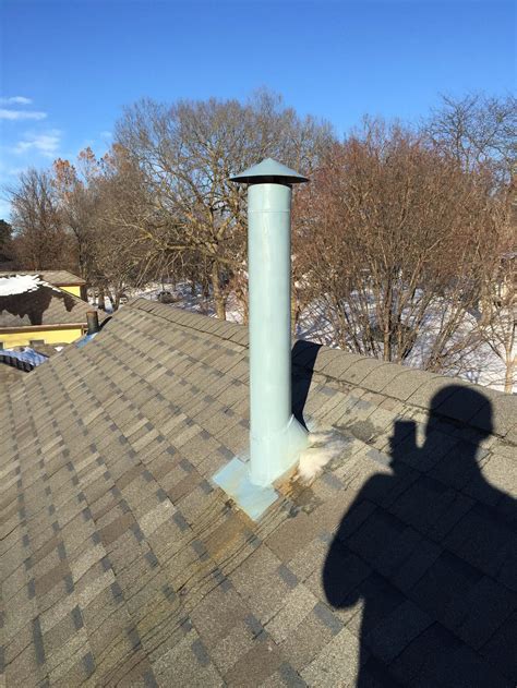 Go through the roof, but do it correctly. Condensation at roof, down outside of furnace/water heater ...
