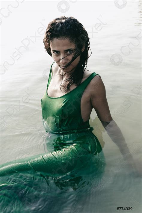 Beautiful Sultry Woman In A Wet Clinging Dress Stock Photo Crushpixel