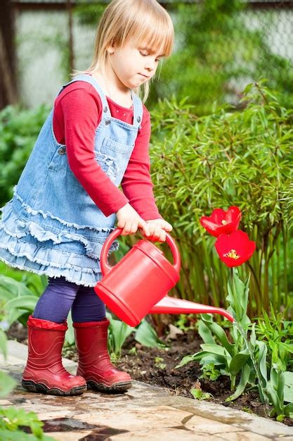 Premium Photo Girl With Watering Can