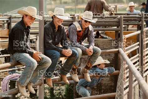This photo is of what i really enjoy doing and that's hanging out with friends. Group Of Cowboys Hanging Out Stock Photo - Download Image ...