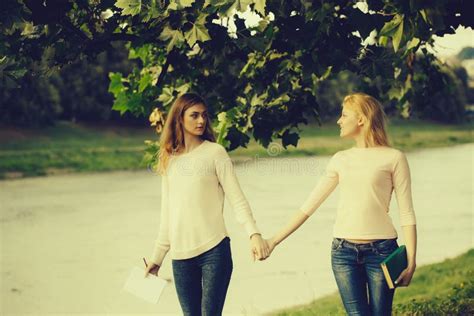 Two Young Girls Hold Hands Stock Photo Image Of Girls 133034958
