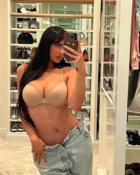 Kylie Jenner S Latest Outfit Included Nothing But A Beige Bra And Slouchy Blue Jeans