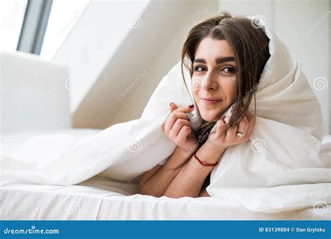 Woman Under A Duvet In Her Bedroom Stock Photo Image Of Lady Bedding