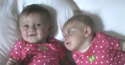 Mom Puts Twins On Beds—eyes Remain On One To The Right