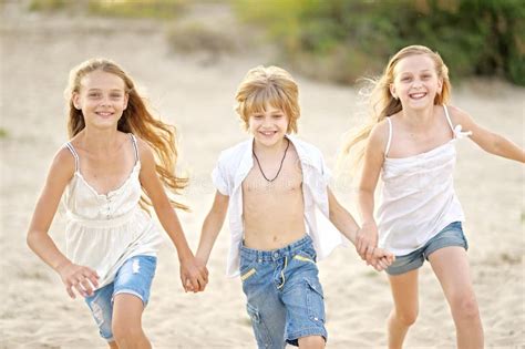 Portrait Of Children On The Beach Stock Photo Image Of Friendship