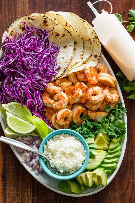 Marinate it for a bit in a delicious seasoning mix with some how do you make shrimp tacos? Shrimp Tacos are loaded with shrimp, cabbage, avocado, cotija, cilantro and served over gluten ...