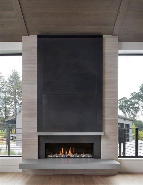 A Linear Fireplace With A Steel Surround And Cantilevered Hearth Is The