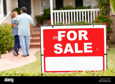 Senior Hispanic Couple Moving Into New Home Stock Photo Alamy