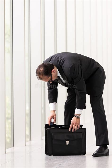 Businessman Searching For Something In Briefcase Stock Image Image Of