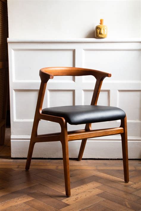 Chilton's solid wood dining chair collection features modern and classic american designs. Right angled image of the Solid Wood Mid-Century Black ...