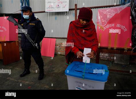 Kathmandu Nepal 20th Nov 2022 A Police Officer Stand Guard As A Woman Casts Her Vote In A