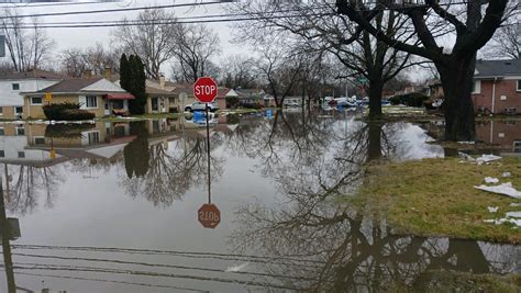 Warren, Dearborn Heights residents clean up after rain, melted snow