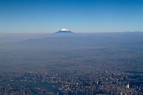 Aerial Shot Of Tokyo With Mount Fuji In The Distance Photorator