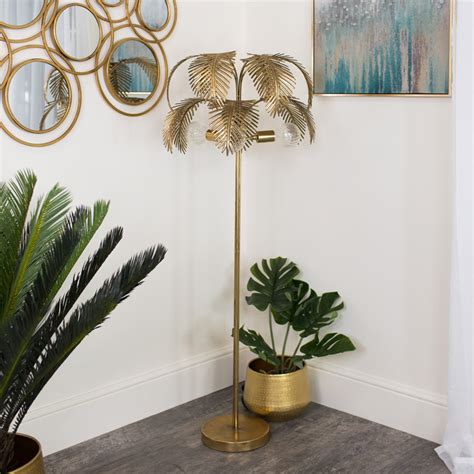 Taking inspiration from breezy beach designs. Large Gold Palm Tree Floor Lamp