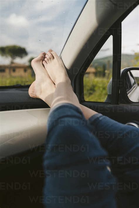 Womans Bare Feet In A Car Stock Photo