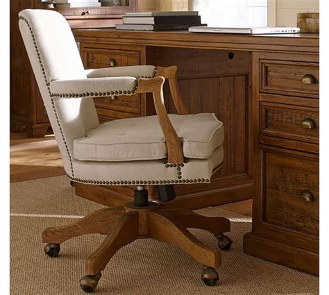 Upholstered in a beautiful tan faux leather with a solid metal frame, it has a slender tall backrest and shaped arm for added comfort. Brock Upholstered Swivel Desk Chair | Pottery Barn