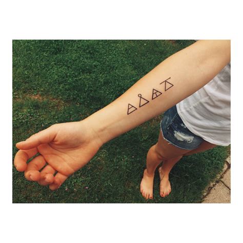 A simple diamond design is rendered on the wearer's wrist in black ink in this tattoo. Explore, learn, create, challenge. | Glyph tattoo, Arm band tattoo, Tattoos