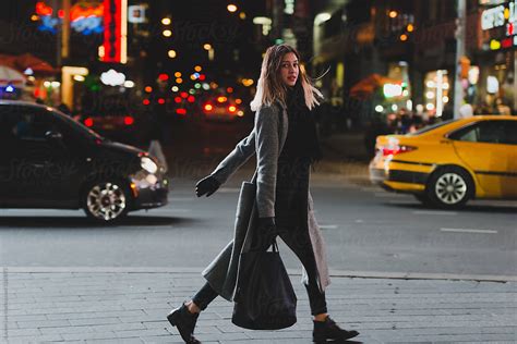 Young Woman Walking In The City At Night By Lauren Lee Stylish On The Go