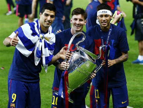Suarez Messi And Neymar Holding The Uefa Champions League Trophy In