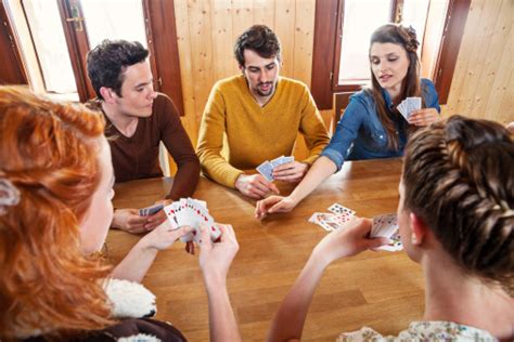 Group Of Friends Playing Cards Stock Photo Download Image Now Istock