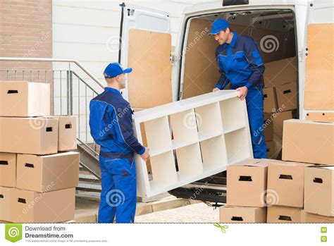 Movers Unloading Furniture From Truck Stock Image Image Of Mover