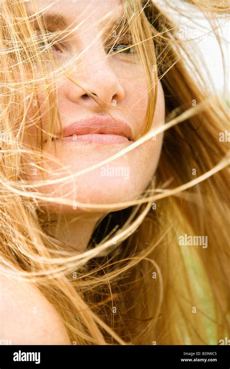 Close Up Portrait Of Attractive Redheaded Woman With Windblown Hair