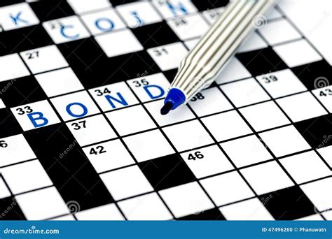 Bond In Solving Crossword Puzzle Stock Photo Image Of Blue Closeup