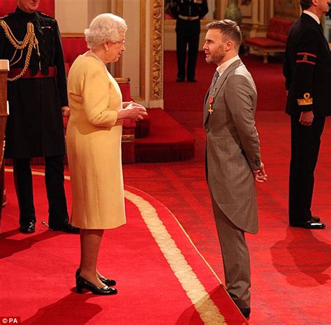 gary barlow returns to buckingham palace to receive obe from the queen daily mail online