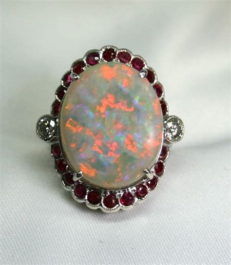 Australian Solid Opal 18k White Gold Ring Surrounded With Rubies And