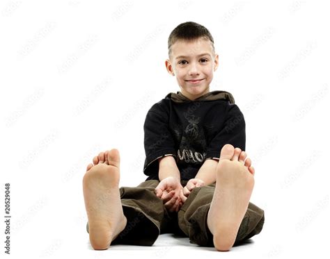 Little Boy Sitting Barefoot Isolated On White Stock Photo Adobe Stock