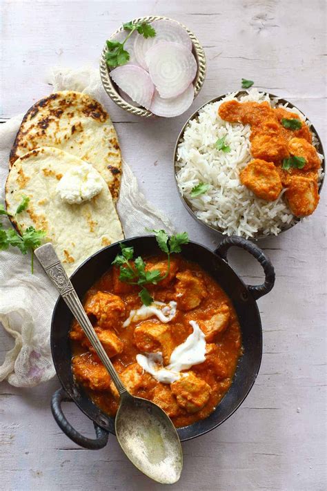 Add the chicken, tomato paste, and spices. 30-Minute Butter Chicken Recipe - Fun FOOD and Frolic