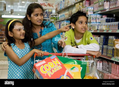Mother With Children Shopping At Supermarket Stock Photo Alamy