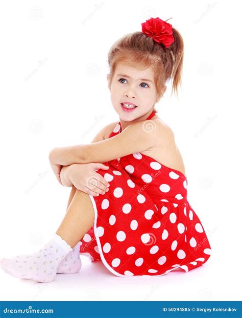 Pretty Little Girl Sitting On The Floor In A Red Stock Image Image Of
