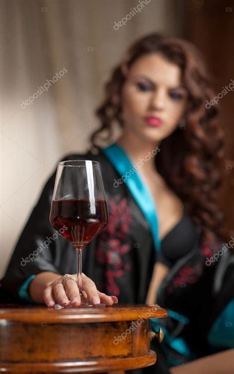 Beautiful Sexy Woman With Glass Of Wine Sitting On Chair Portrait Of A