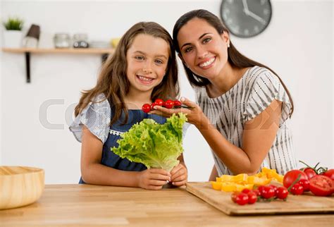 Mother And Daughter Cooking Stock Image Colourbox