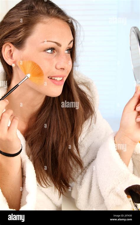 Woman Putting On Lipstick Stock Photo Alamy
