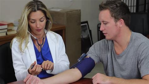 Nurse Taking Blood Pressure Stock Footage Video 100 Royalty Free