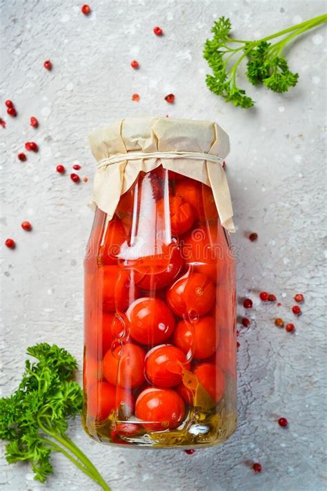 Homemade Pickled Cherry Tomatoes In A Glass Jar Food Supplies Stock