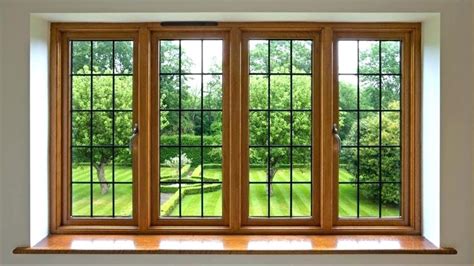 A turquoise front door brings a pop of color in this house that are clad in light wood sidings. Latest House Window Grill Designs 2019 I Amazing Good ...