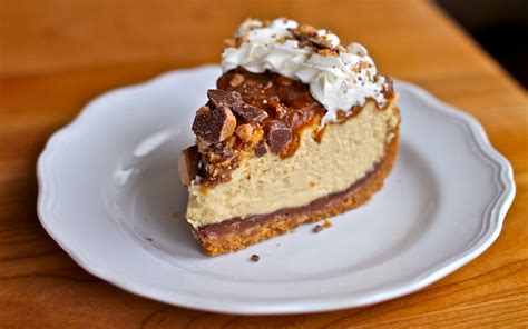 Garnished with whipped cream and chocolates. Yammie's Noshery: Caramel Toffee Crunch Cheesecake